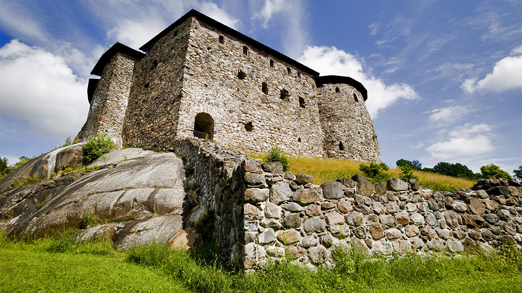 The castle on a rock in the sunshine.