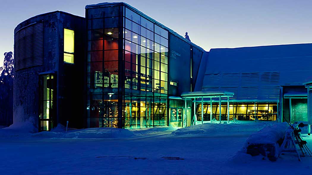 A high concrete building with large windows.